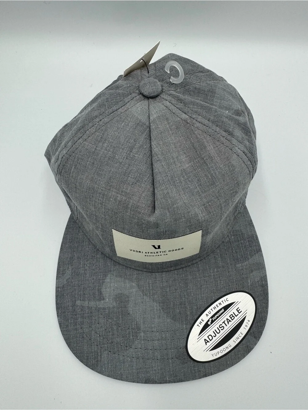 Vuori Gray Five-Panel Adjustable Cap/ Front Patch with faint camo design on brim